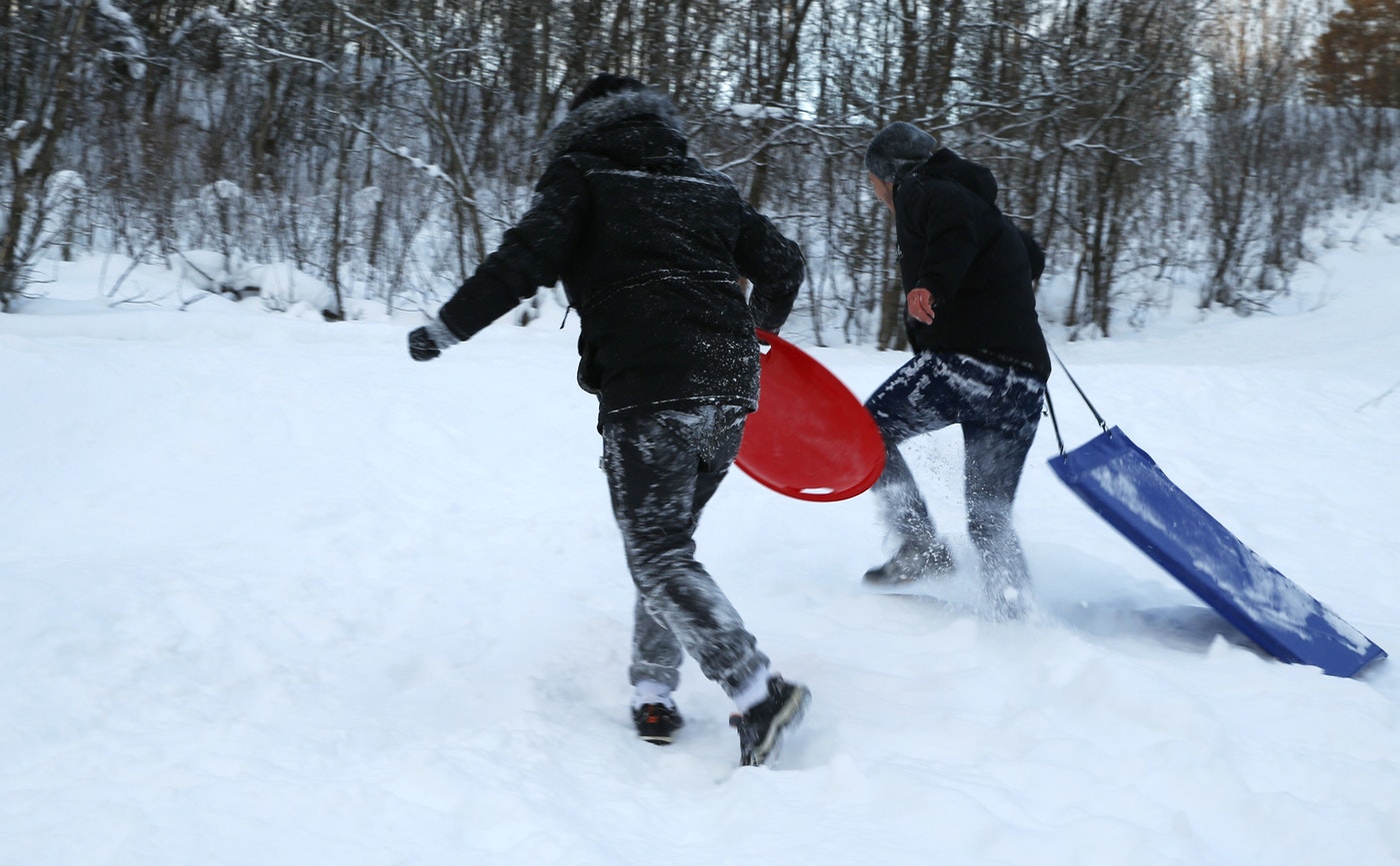 Afghan children who came to Europe as “unaccompanied minors” pull sleds up a small hill in northern Norway. In Norway and Sweden, about one in five asylum seekers in 2015 was a minor traveling alone. (AP/Alastair Grant)