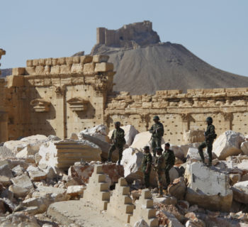 FILE PHOTO: Syrian army soldiers stand on the ruins of the Temple of Bel in the historic city of Palmyra, in Homs Governorate, Syria April 1, 2016. REUTERS/Omar Sanadiki/File Photo